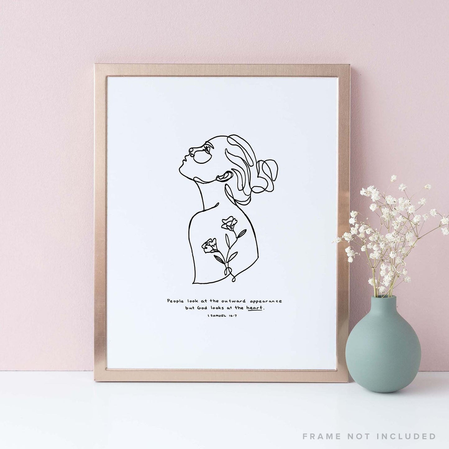 Framed Scripture Art Print of "People look at the outward appearance but God looks at the heart." - 1 Samuel 16:7 on pink background