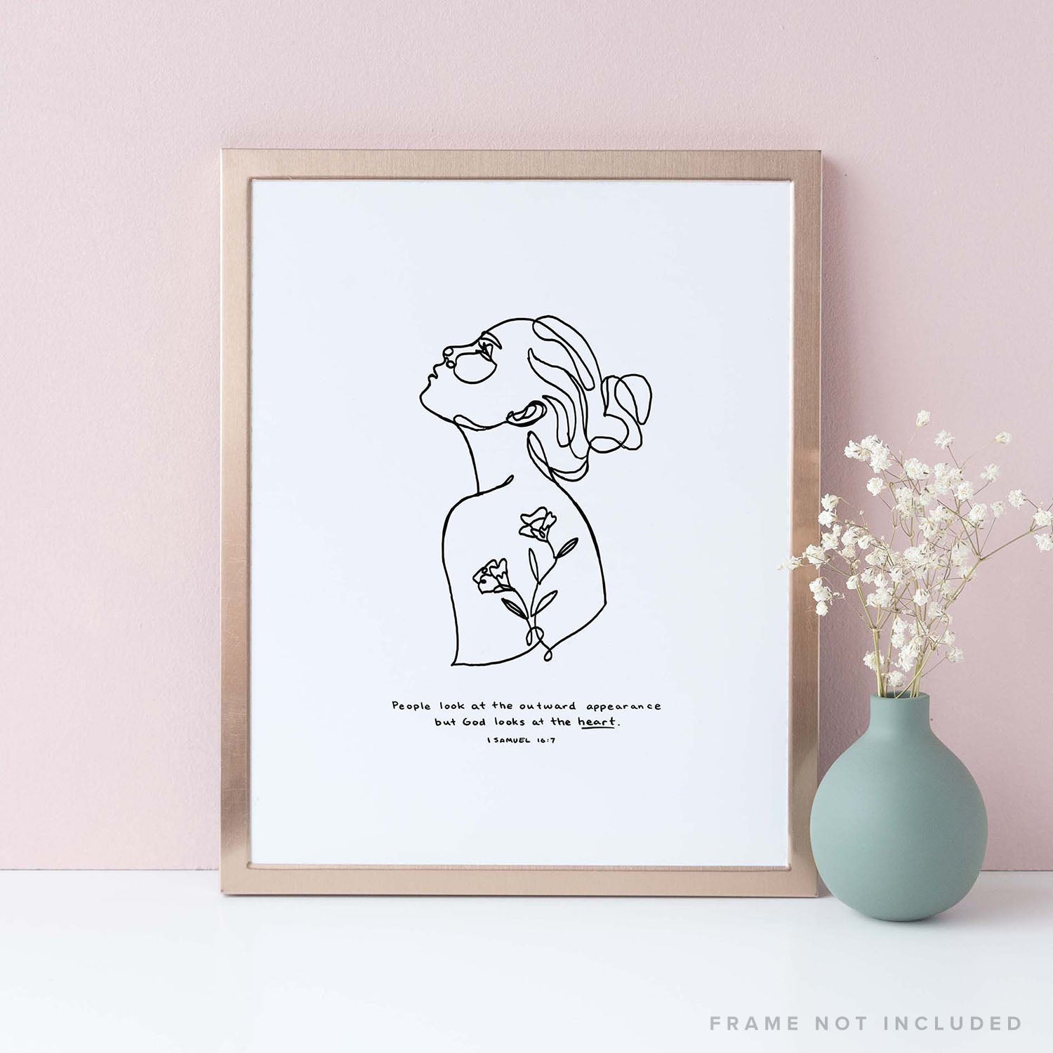 Framed Scripture Art Print of "People look at the outward appearance but God looks at the heart." - 1 Samuel 16:7 on pink background